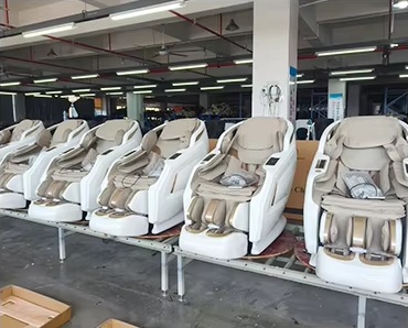 White massage chairs on the assembly line
